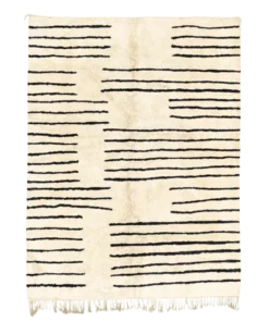 Handwoven striped wool rug with irregular black lines on a beige background – Moroccan Berber design called Broken Silence.