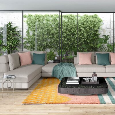 Bohemian rugs with colorful yellow and green patterns adding warmth to a bright living room with indoor plants.