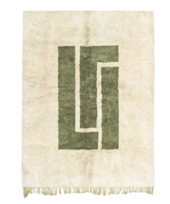 Atlas Heart green and beige area rug with bold central geometric design