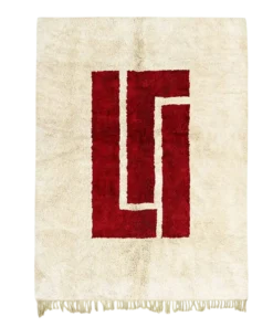 Atlas Heart red and beige area rug with bold geometric central motif