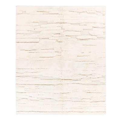 White Moroccan rugs with subtle geometric patterns handwoven by artisans.