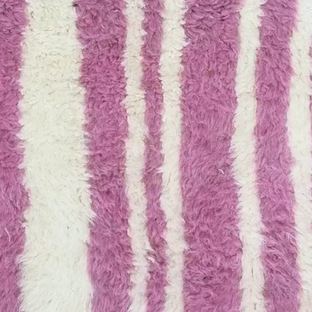 Rose Rhythm pink and white rug with vertical stripes handwoven in Moroccan wool